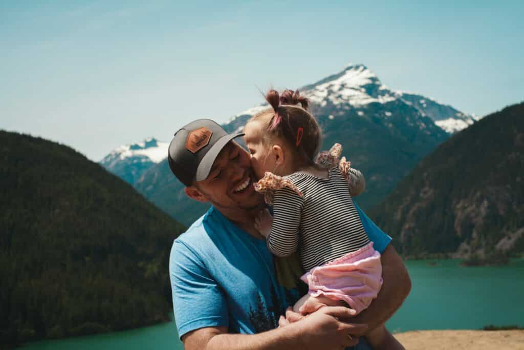 an image of a man holding his daughter