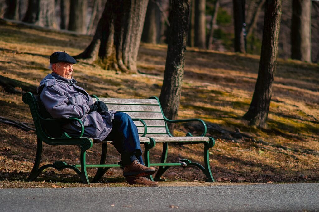 An image of an old man on a bench | Signs of Substance Abuse in Older Adults