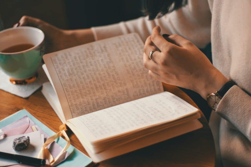 An image of a woman journaling | How to Manage Triggers