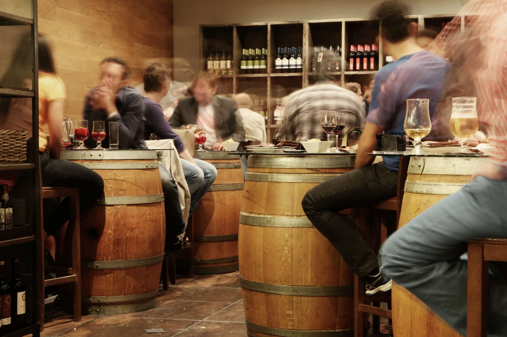 An image of people at a bar | How long does alcohol stay in your system