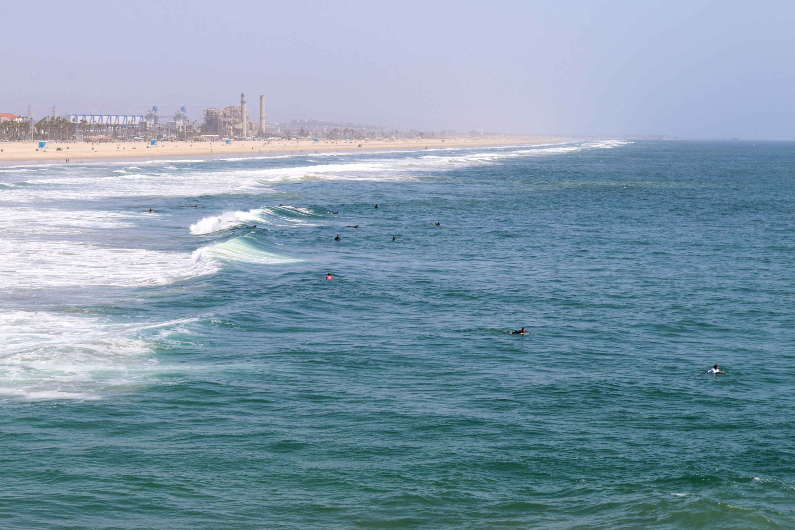 an image of the beach and surfers in Huntington Beach