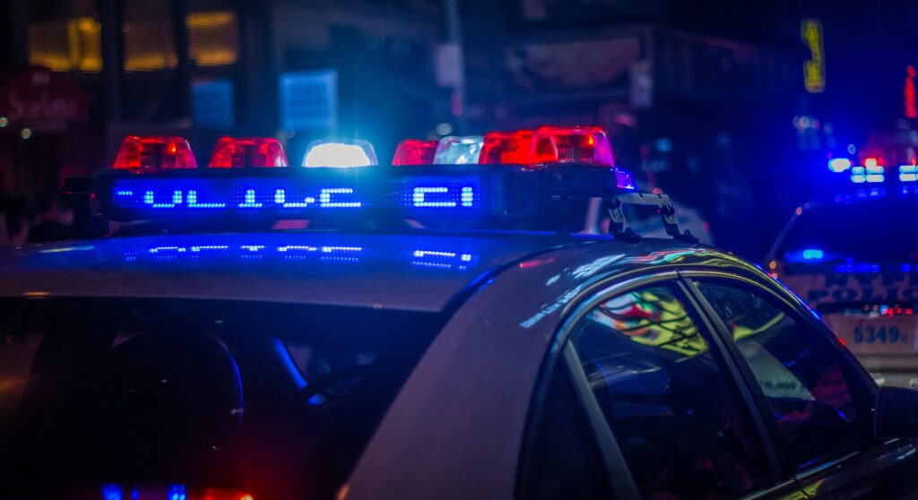 an image of a cop car representing addiction-related crimes in Newport Beach