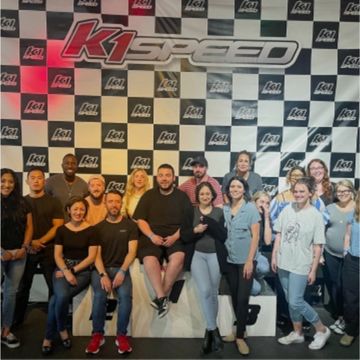 Group of people taking a photo at K1 speed