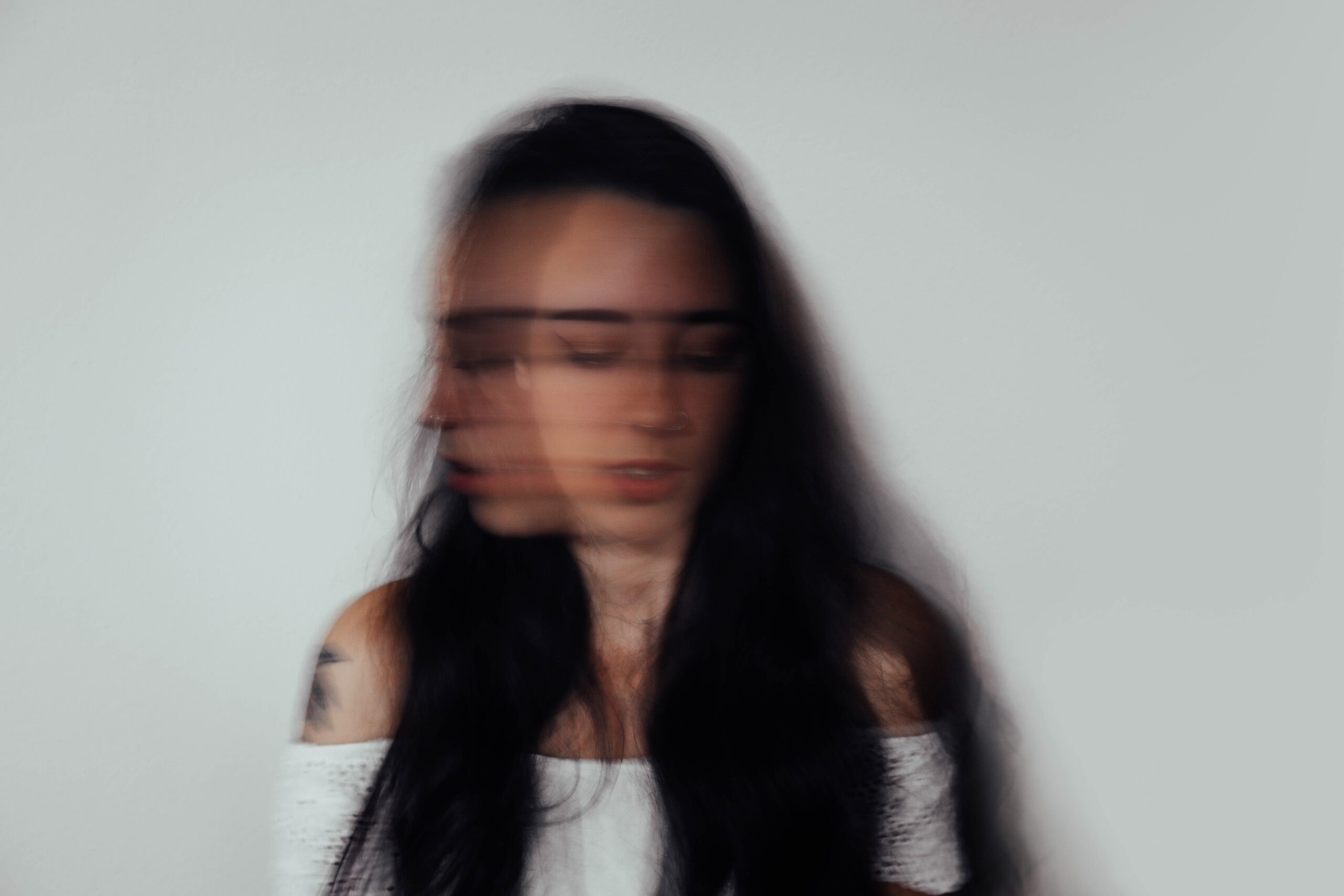 a woman's image is blurred to represent xanax side effects.