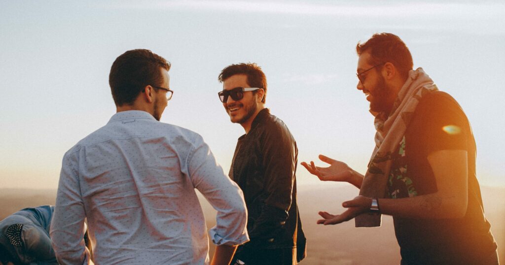 group of people laughing at sunset representing weed and brain damage