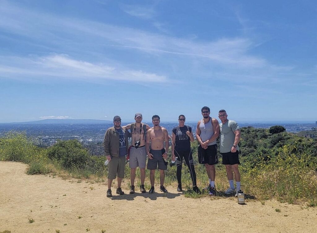group of people posing together on a hike