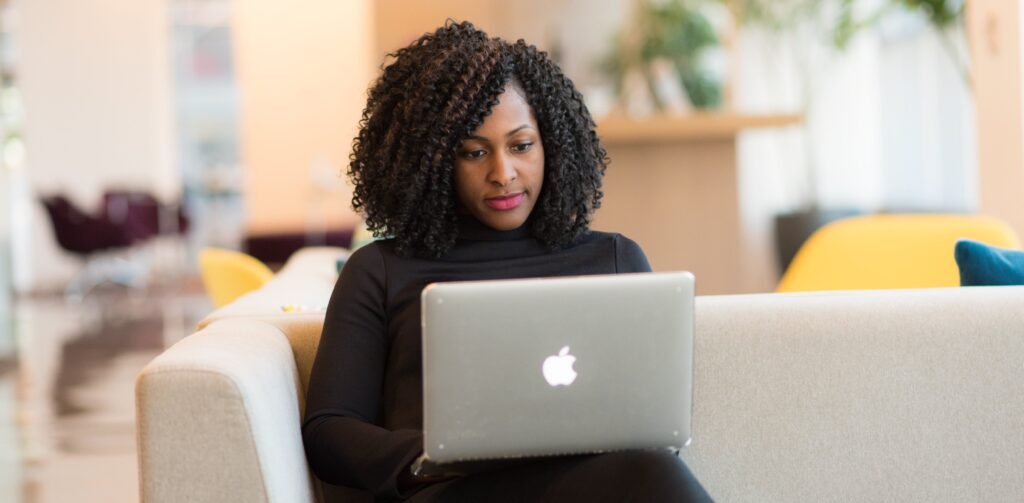 woman on laptop representing online IOP programs