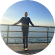 Icon of person standing at pier